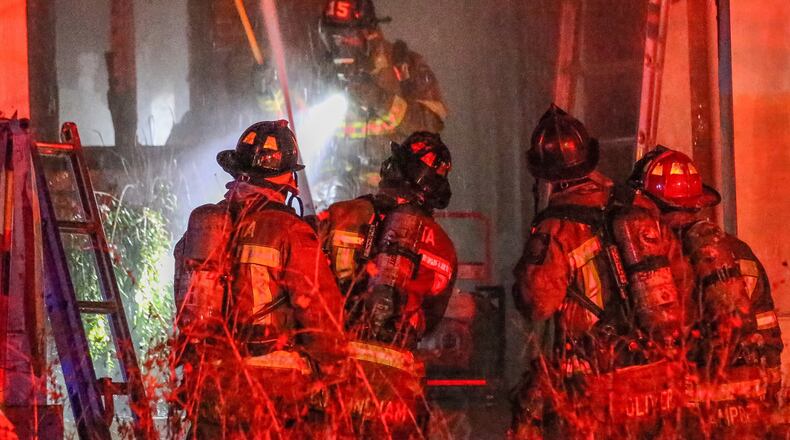 Crews extinguished a blaze that damaged the first floor of a home Friday in northeast Atlanta. JOHN SPINK / JSPINK@AJC.COM