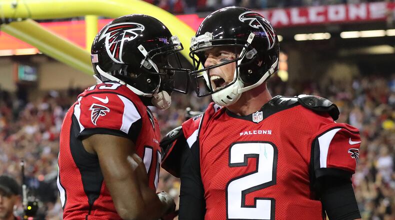 Falcons quarterback Matt Ryan reacts to scoring a touchdown on a quarterback keeper against the Packers during the second quarter in the NFC Championship game Sunday, Jan. 22, 2017, in Atlanta. (Curtis Compton/ccompton@ajc.com)