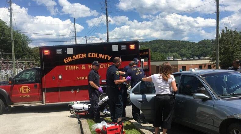 Firefighters gather in the fire house parking to help deliver a baby. Firefighter Gene Hightower helped deliver the baby girl in the back seat of the couple’s car. (Credit: Ellijay Fire Department)