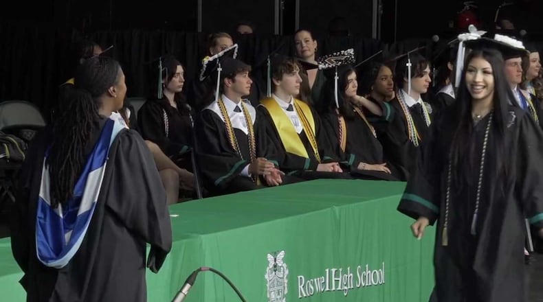 A Roswell High School student receives her degree during the 2024 commencement ceremony. (Courtesy of Fulton County Schools)