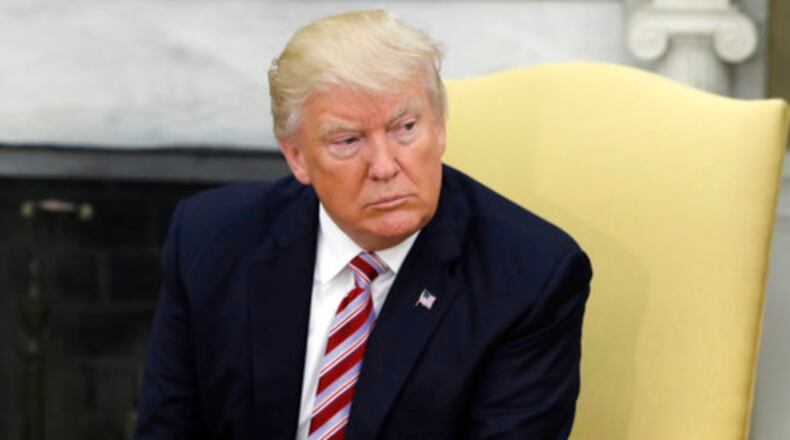 President Donald Trump talks to reporters during a meeting with Dr. Henry Kissinger, former Secretary of State and National Security Advisor under President Richard Nixon, in the Oval Office of the White House, Wednesday, May 10, 2017, in Washington. (AP Photo/Evan Vucci)