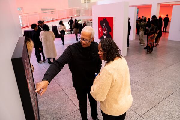 U.S. Rep Hank Johnson and his wife, DeKalb Commissioner Mereda Johnson, Slawn’s show at the High on Friday. (Arvin Temkar/AJC)