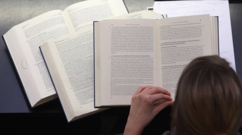 BERLIN, GERMANY - OCTOBER 11: A student studies legal textbooks in the law faculty at Humboldt University prior to the beginning of the winter semester on October 11, 2011 in Berlin, Germany. German universities recorded a record 2.218 million matriculations in the 2010/2011 winter semester, a rise of 4.5%, and expect even more students in the coming winter semester, which starts in October. The end of compulsory military service in the Bundeswehr, the German armed forces, which went into effect earlier this year, is a major contributing factor to the rise in the numbers of students arriving at universities across the country. (Photo by Adam Berry/Getty Images) Students may need to brush up on the law before the pivotal third date. (Getty Images)