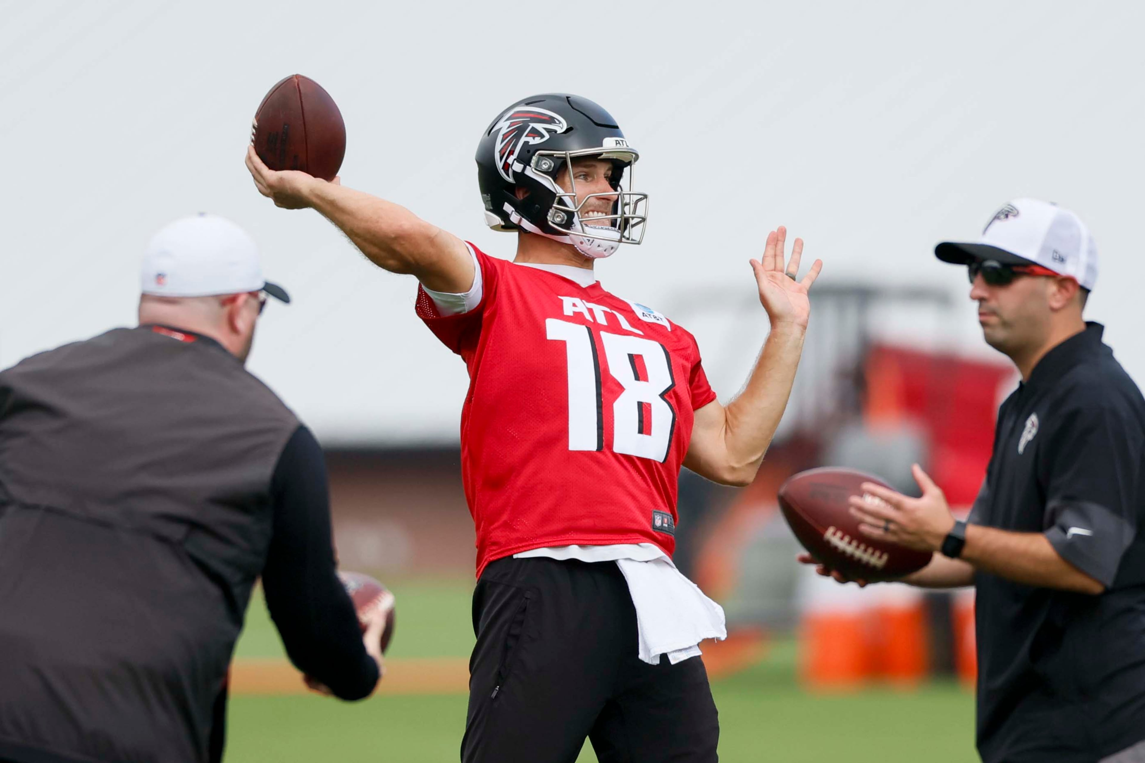Atlanta Falcons quarterback Kirk Cousins attempts a pass during the first practice of training camp Thursday. (Miguel Martinez/AJC)
