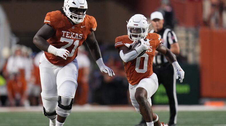 Texas running back Raleek Brown (0) runs against Ohio State during the first half of an NCAA college football game in Austin, Texas, Saturday, Sept. 12, 2026. (AP Photo/Eric Gay)
