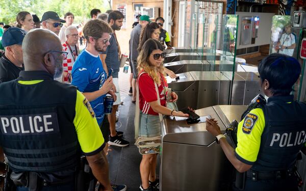 Soccer fans tap to enter the Vine City MARTA station after the South Africa verses Czechia match on Thursday, June 18, 2026. (Ben Hendren for the AJC)