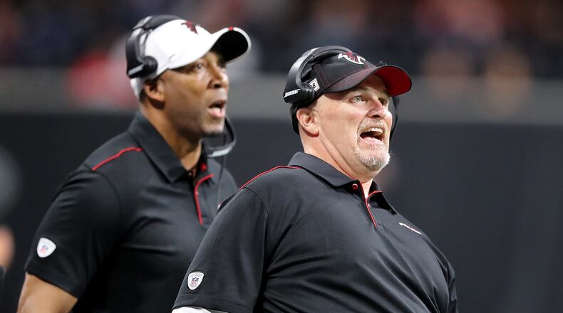 Falcons head coach Dan Quinn (right) uses body english during a field-goal attempt while playing the Washington Redskins in a NFL preseason game on Thursday, August 22, 2019, in Atlanta. The Falcons lost 19-7. Curtis Compton/ccompton@ajc.com