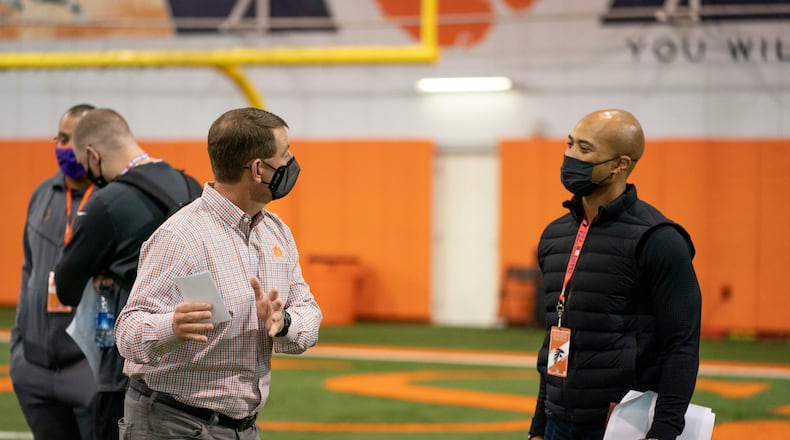 Falcons general manager Terry Fontenot talking with Clemson coach Dabo Swinney at quarterback Trevor Lawrence's Pro Day workout on Friday, February 12, 2021. (Photo credit: Courtesy of David Platt/Clemson Athletics)