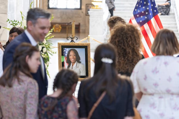 Attendees pay their respects during a funeral service for former U.S. Rep. Mia Love, Sunday, April 6, 2025, in Salt Lake City. (AP Photo/Melissa Majchrzak)