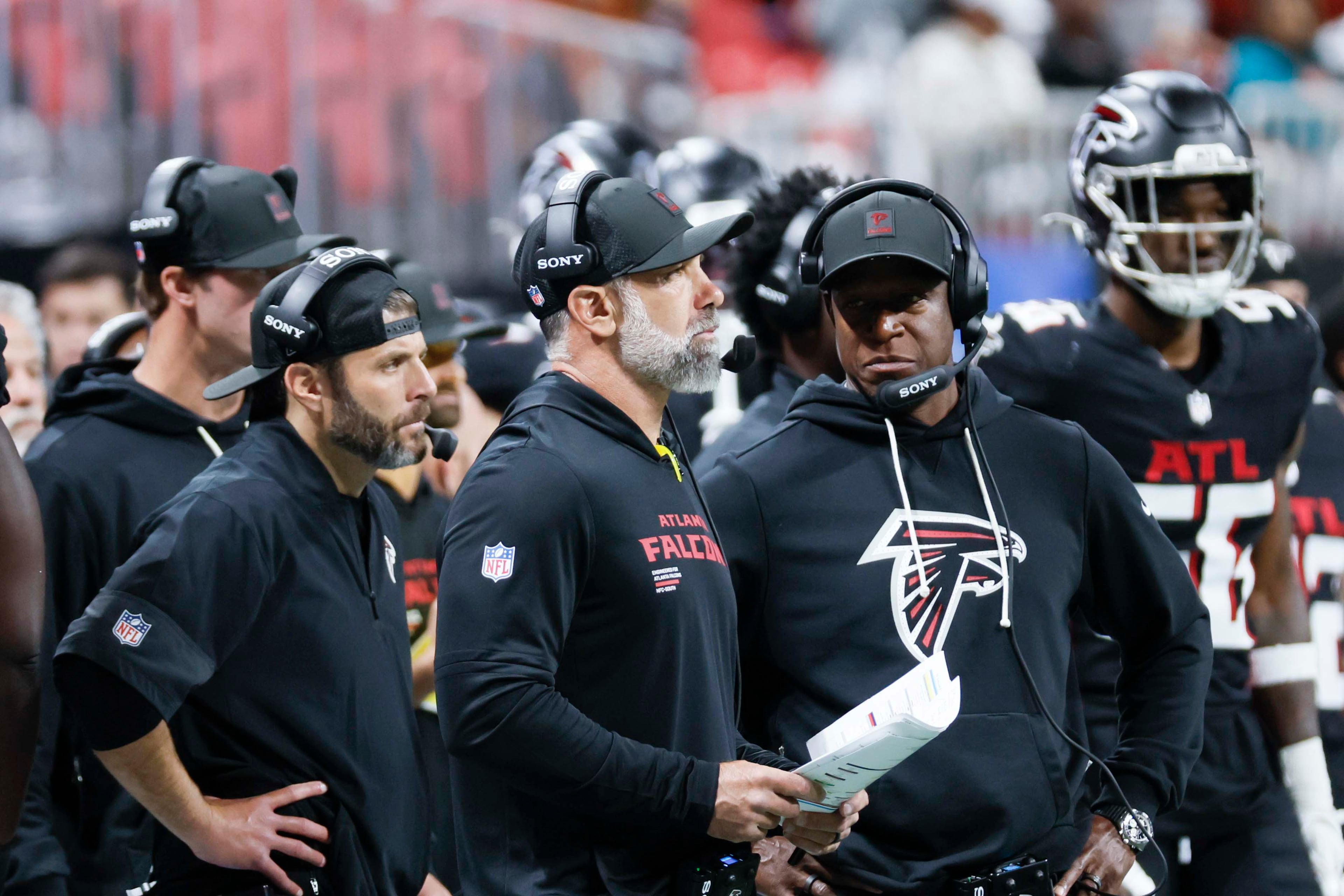 Atlanta Falcons head coach Raheem Morris discusses strategy with defensive coordinator Jeff Ulbrich during the second half of an NFL game against the Miami Dolphins at Mercedes-Benz Stadium in Atlanta on Sunday, Oct. 26, 2025. (Miguel Martinez/AJC)