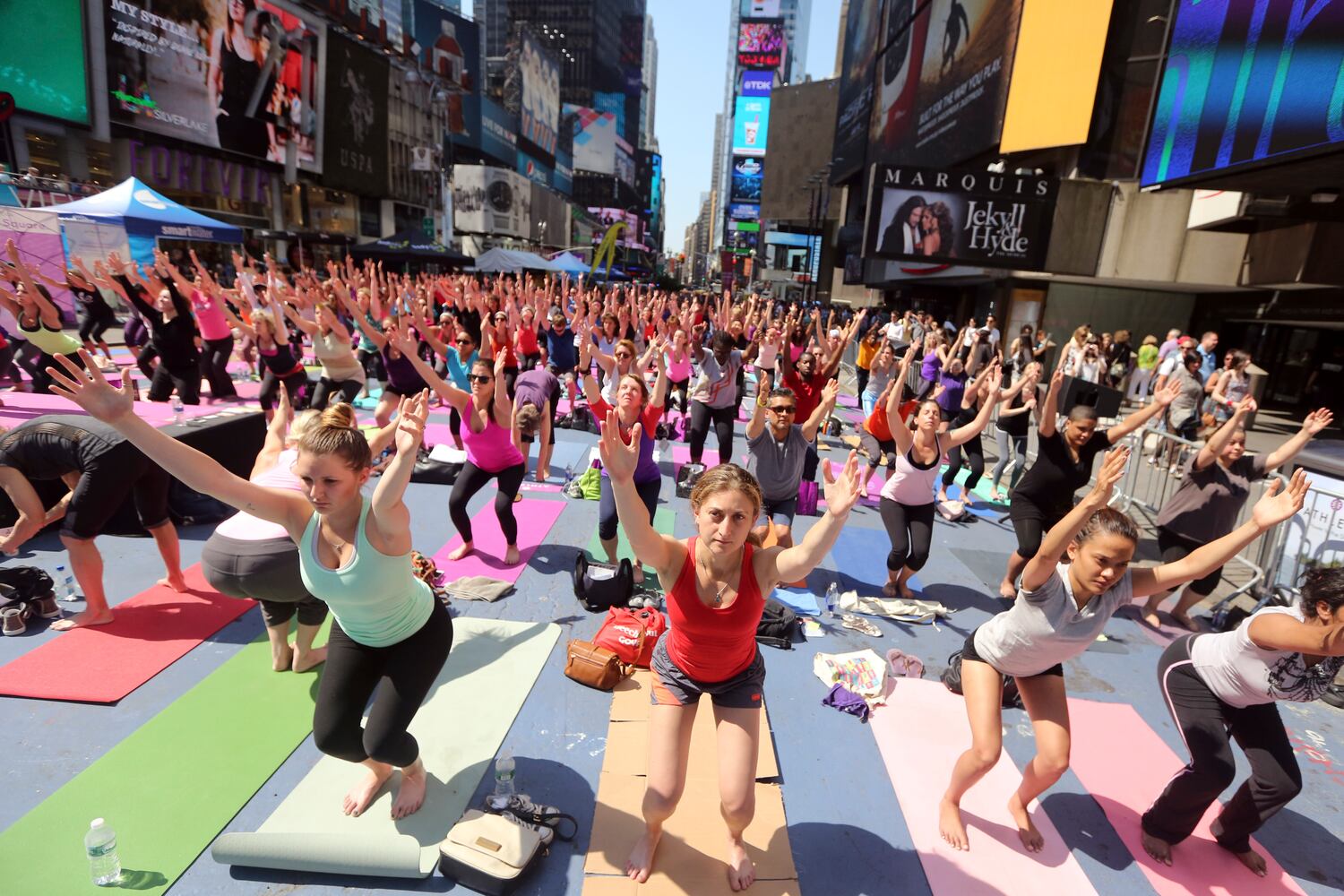Enthusiasts perform yoga in Times Square to mark summer solstice, June 21, 2013