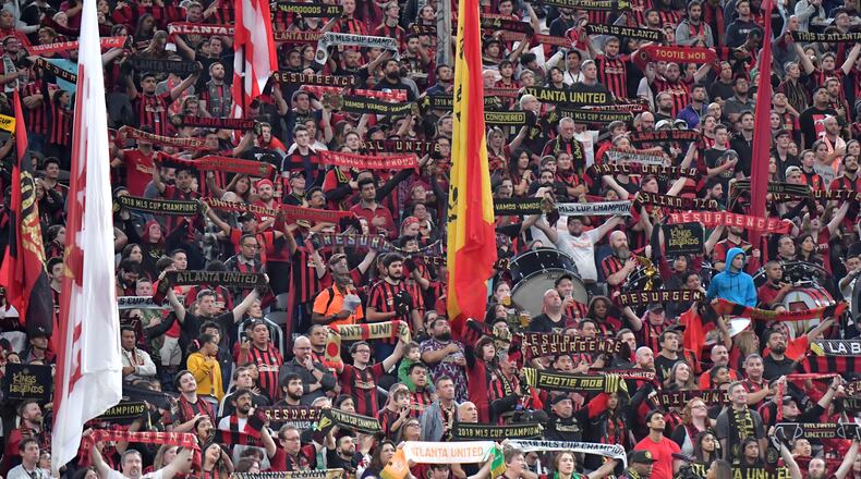 October 19, 2019 Atlanta - Atlanta United fans hold banners before the first round of the MLS playoffs between the Atlanta United and the New England Revolution at Mercedes-Benz Stadium on Saturday, October 19, 2019. Atlanta United won 1-0 over the New England Revolution. (Hyosub Shin / Hyosub.Shin@ajc.com)