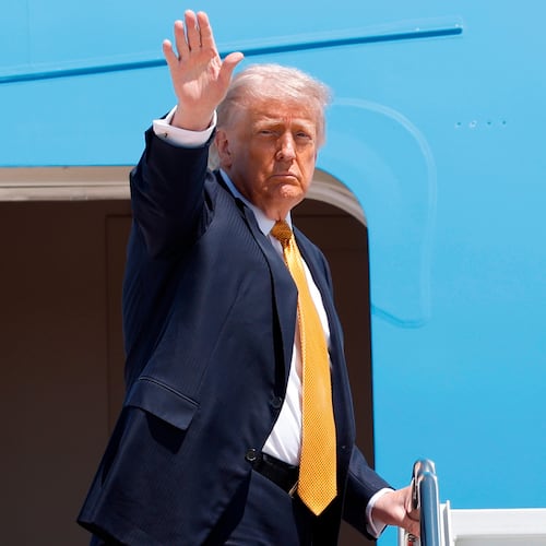President Donald Trump waves from the stairs of Air Force One as he boards upon his arrival at Joint Base Andrews, Md., Tuesday, May 12, 2026, for a trip to China to meet President Xi Jinping. (AP Photo/Luis M. Alvarez)