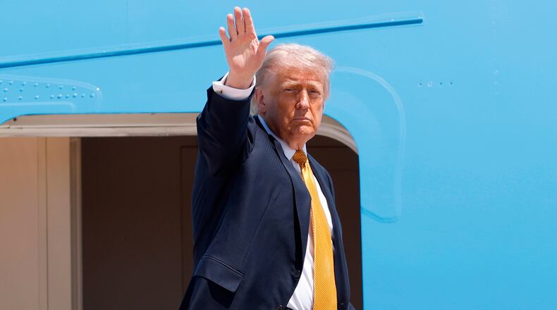 President Donald Trump waves from the stairs of Air Force One as he boards upon his arrival at Joint Base Andrews, Md., Tuesday, May 12, 2026, for a trip to China to meet President Xi Jinping. (AP Photo/Luis M. Alvarez)