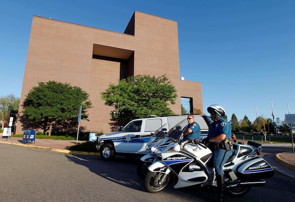 FILE - Law enforcement personnel provide security for a court appearance at the Arapahoe County Courthouse, July 23, 2012, in Centennial, Colo. (AP Photo/Alex Brandon, File)