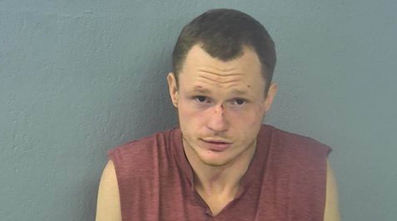 his Feb. 4, 2019 booking photo released by Springfield, Mo., Police Department shows James Simpson. Charging documents say a swastika and "family values" tattoo helped police identify the Missouri man charged with choking, raping and stabbing a woman.