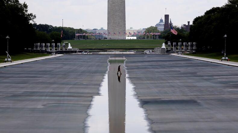 The Washington Monument is seen in the background of the now drained Lincoln Memorial Reflecting Pool, Wednesday, July 29, 2026, in Washington. (AP Photo/Rahmat Gul)