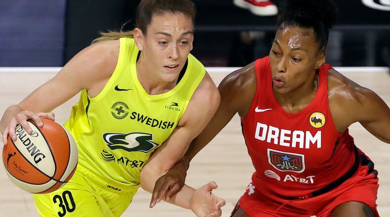 Seattle Storm forward Breanna Stewart (30) gets stopped by Atlanta Dream forward Betnijah Laney (44) during the first half Wednesday, Aug. 12, 2020, in Bradenton, Fla.