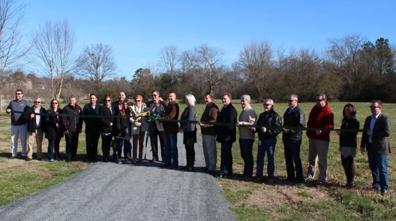 County officials gather to cut the ribbon on an upgrade at Chattahoochee Pointe Park in South Forsyth