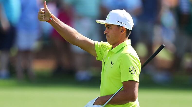 Rickie Fowler gives the gallery a thumbs up hitting his fairway shot close to the cup on the third hole on his way to a birdie during his practice round for the Masters at Augusta National Golf Club on Monday, April 2, 2018, in Augusta. Curtis Compton/ccompton@ajc.com