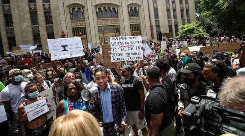 Hundreds of people gathered on the steps of Atlanta City Hall Monday for a fourth day of protests across the region. This group marched from City Hall to the Atlanta City Detention Center and back to City Hall. Alyssa Pointer/Alyssa.Pointer@ajc.com