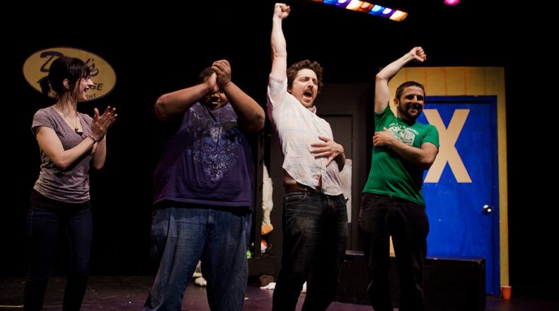Dad's Garage Theatre celebrates a quarter century with virtual improv shows, a silent auction and surprise guests. AJC File