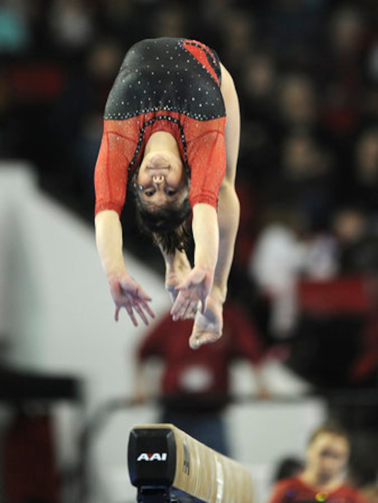 Gym Dogs win in coach's last home meet