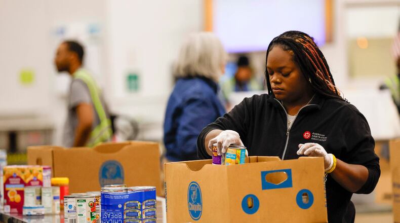 Volunteers are seen packing food at the Hunger Action Center at the Atlanta Community Food Bank Distribution Center on Wednesday, Oct. 29, 2025. State lawmakers are appealing to members of Congress to end the shutdown that has threatened food programs and left federal workers without pay. (Miguel Martinez/AJC)
