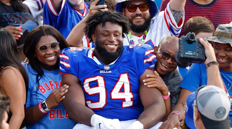 Buffalo Bills defensive tackle Prince Emili (94) sits in the stands following a preseason NFL football game, Saturday, Aug. 13, 2022, in Orchard Park, N.Y. The Bills won 27-24. (AP Photo/Jeffrey T. Barnes)