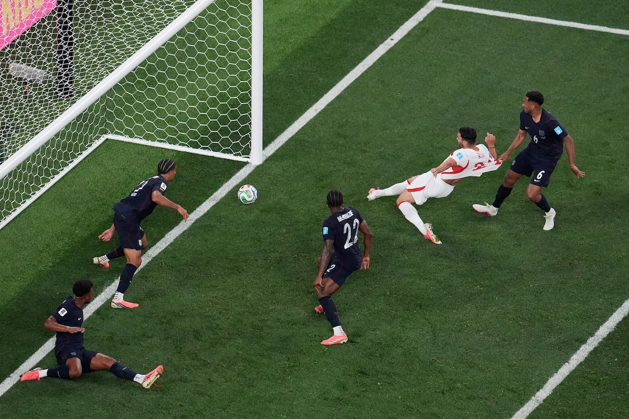 Turkey's Kaan Ayhan, second from right, scores their third goal as United States' Auston Trusty (6) defends and United States' Mark McKenzie (22) and United States' Miles Robinson (12) look on during the second half of a World Cup Group D soccer match in Inglewood, Calif., near Los Angeles, Thursday, June 25, 2026. (AP Photo/Marcio J. Sanchez)