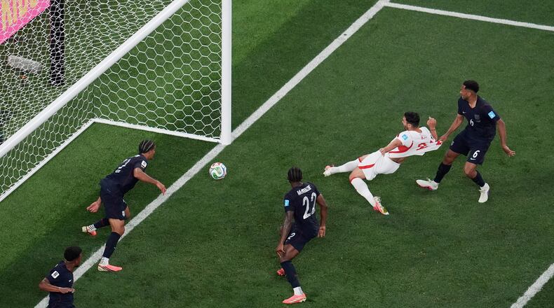 Turkey's Kaan Ayhan, second from right, scores their third goal as United States' Auston Trusty (6) defends and United States' Mark McKenzie (22) and United States' Miles Robinson (12) look on during the second half of a World Cup Group D soccer match in Inglewood, Calif., near Los Angeles, Thursday, June 25, 2026. (AP Photo/Marcio J. Sanchez)