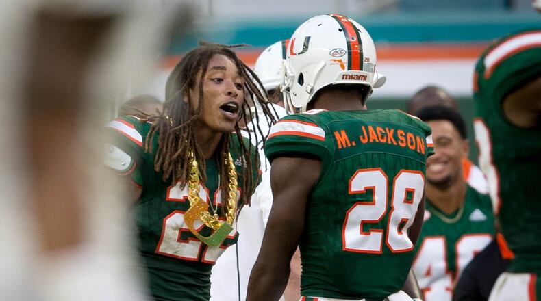 Miami Hurricanes defensive back Sheldrick Redwine (22) earns the "Turnover Chain" after recovering a fumble by Toledo Rockets quarterback Logan Woodside (11) at Hard Rock Stadium in Miami Gardens, Florida on September 23, 2017. (Allen Eyestone / The Palm Beach Post)