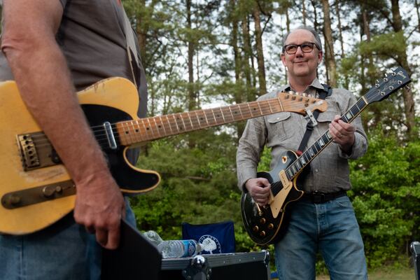 Retired federal judge and mediator Clay Fuller hangs out backstage before playing a show with Allgood in Roswell on Saturday, April 11, 2026. (Ben Gray for the AJC)