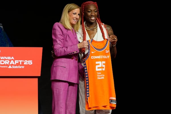 North Carolina State's Saniya Rivers, right, poses with WNBA commissioner Cathy Engelbert after being selected eighth overall by the Connecticut Sun during the first round of the WNBA basketball draft, Monday, April 14, 2025, in New York. (AP Photo/Pamela Smith)