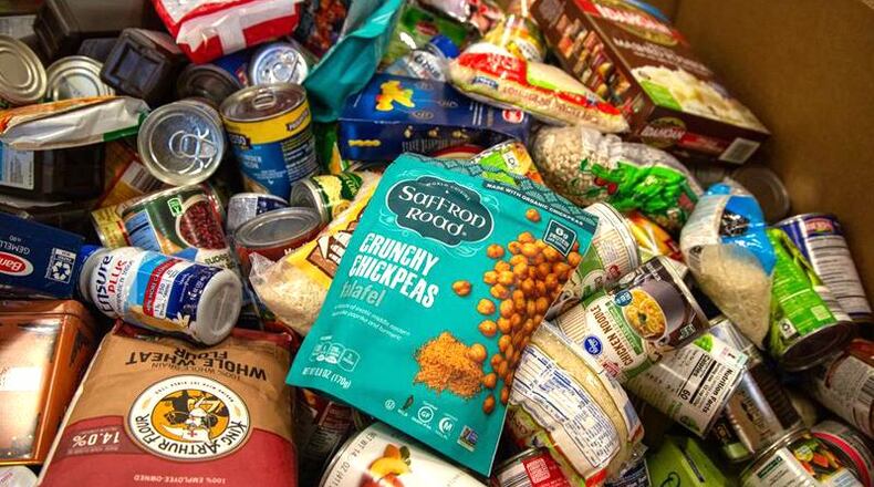 The city of Woodstock announced it will begin acccepting applications Monday, Oct. 12, for COVID-19 grants of $5,000 to $10,000 to nonprofits that operate food pantries serving city residents. AJC FILE