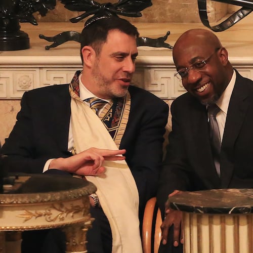 Chief Rabbi Peter S. Berg (left) and Rev. Raphael G. Warnock talk during the joint Martin Luther King Jr. Shabbat service on Friday, Jan. 17, 2020, at The Temple in Atlanta. Each year the congregations from The Temple and Ebenezer Baptist Church join for a Shabbat service to honor Martin Luther King Jr. as a symbol of the Black and Jewish alliance in Atlanta. (Christina Matacotta for the AJC)
