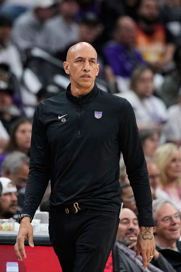 Sacramento Kings interim head coach Doug Christie watches during the first half of an NBA play-in tournament basketball game against the Dallas Mavericks, Wednesday, April 16, 2025, in Sacramento, Calif. (AP Photo/Godofredo A. Vásquez)