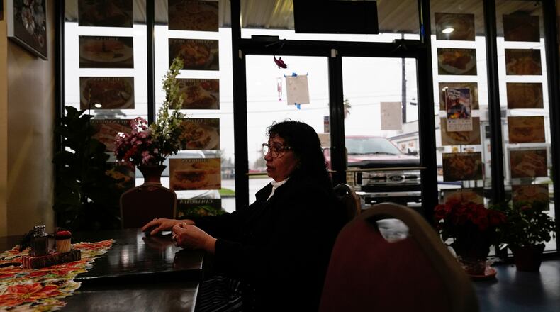 Carmela Diaz speaks inside her closed restaurant in the midst of a Customs and Border Protection immigration crackdown in Kenner, La., Thursday, Dec. 4, 2025. (AP Photo/Gerald Herbert)