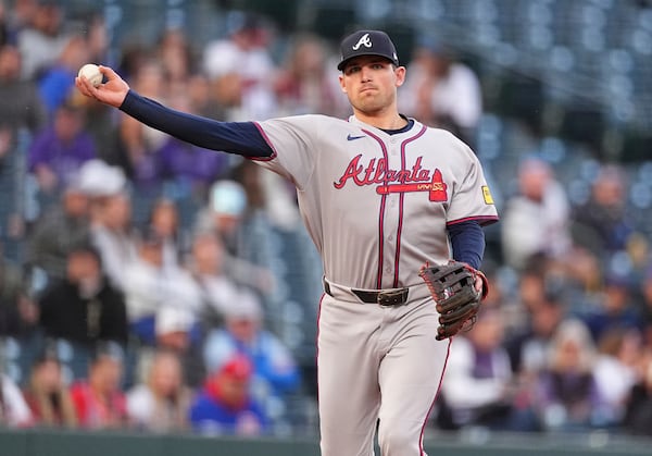 Atlanta Braves third baseman Austin Riley throws to first base to put out Colorado Rockies' Jacob Stallings in the second inning of a baseball game Monday, April 28, 2025, in Denver. (AP Photo/David Zalubowski)