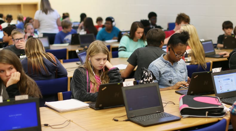 Oct. 16, 2015 - Locust Grove - Students work independently in one of the “Flex Labs” at the school. At Locust Grove Middle School in Henry County, middle school students choose their own options in coursework for meeting standards and move on to the next subject when they are ready. They do some of their work independently in large “flex labs” in order to create smaller than usual student-teacher ratios. BOB ANDRES / BANDRES@AJC.COM