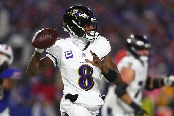 FILE - Baltimore Ravens quarterback Lamar Jackson (8) looks to pass the ball during the first half of an NFL football divisional playoff game against the Buffalo Bills in Orchard Park, N.Y., Jan. 19, 2025. (AP Photo/ Jeffrey T. Barnes, File)