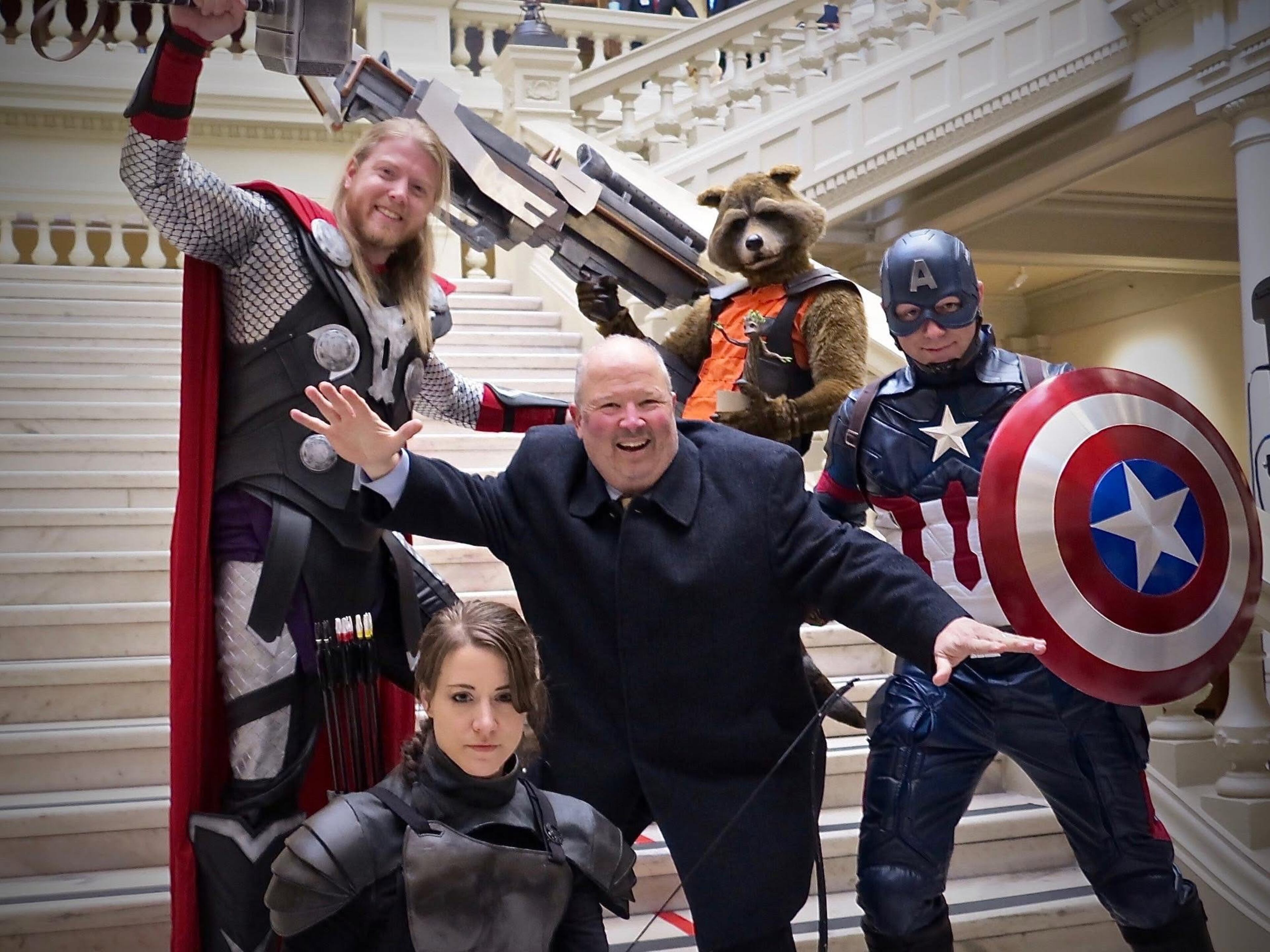 Craig Miller, center, poses with Marvel superheroes at the Georgia State Capitol. (Courtesy of Craig Miller)
