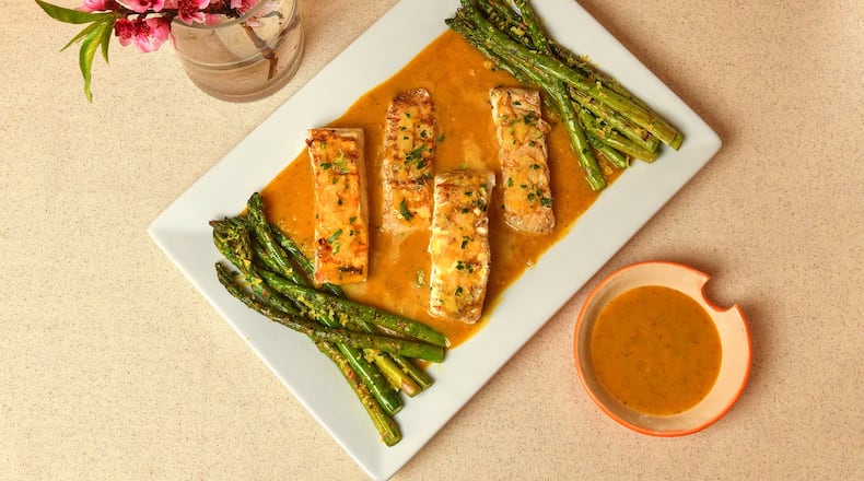 Grilled Pineapple Mango Halibut is served with Fiery Pineapple Mango AubSauce, which gets its heat from serrano peppers. Styling by Aubrey Lenyard / Chris Hunt for the AJC
