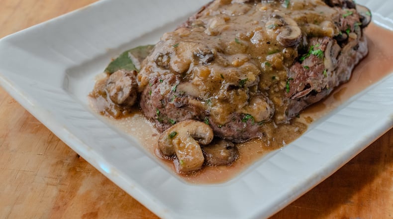 Ground bison meatloaf served with mushroom gravy is comfort food that’s big on flavor, with less fat than traditional ground beef meatloaf. (Virginia Willis for The Atlanta Journal-Constitution)