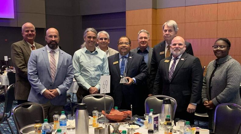 Fayetteville Mayor Ed Johnson (center) and other city representatives accepted a Livable Center award from the Atlanta Regional Commission on Nov. 16. Courtesy City of Fayetteville