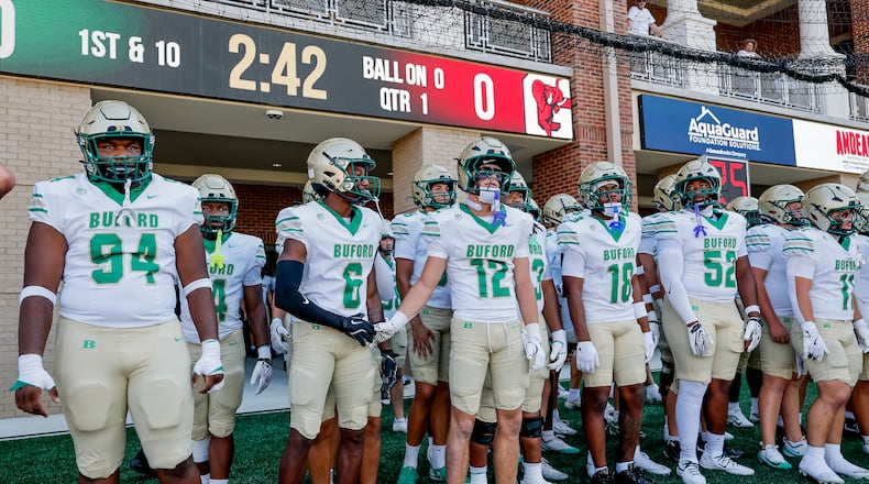 Buford readies to take the field before the first half of a high school football game between Buford and Gainesville, Saturday, Aug. 22, 2026, in Buford, GA. (Erik S. Lesser for the AJC)