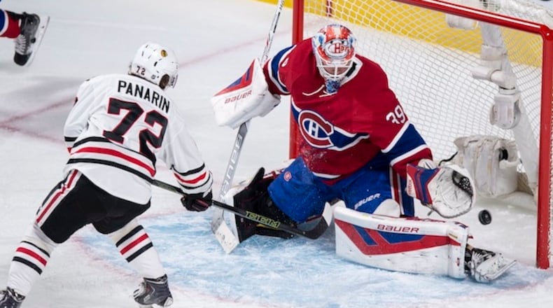 Montreal Canadiens goalie Mike Condon makes a save on Chicago Blackhawks' Artemi Panarin during the first period of an NHL hockey game Thursday, Jan. 14, 2016, in Montreal. (Paul Chiasson/The Canadian Press via AP)