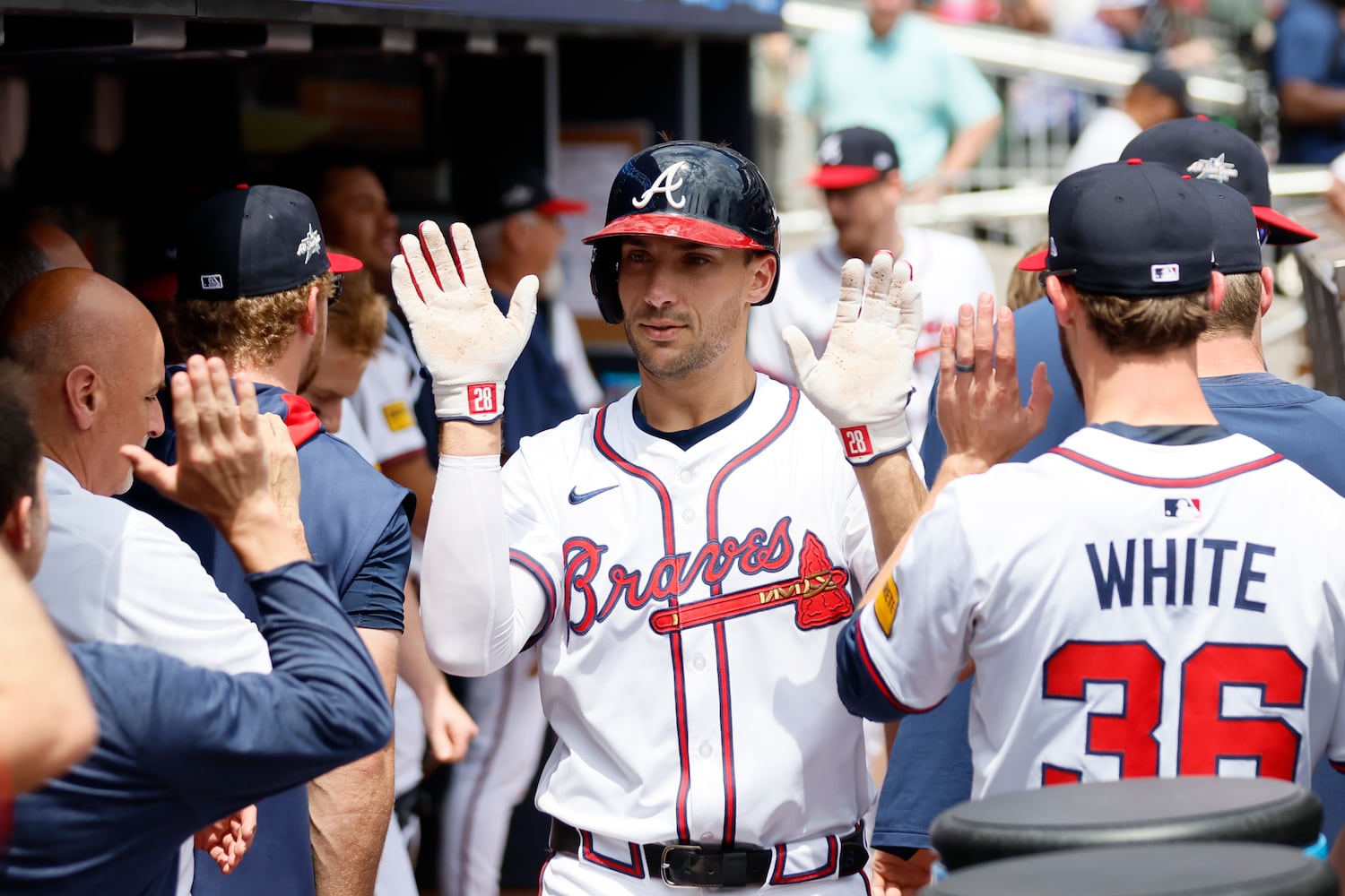 Atlanta Braves first base Matt Olson (28) it’s congratulated by teammates at the dugout after hitting a two-RBI home. run during the first inning against the Minnesota Twins at Truist Park on Sunday, April 20, 2025, in Atlanta. 
(Miguel Martinez/ AJC)