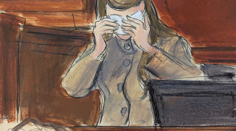 In this courtroom sketch, a witness, testifying under the pseudonym "Katie Moore," cries on the witness stand in Manhattan federal court on the first day of the sex trafficking trial of Alon Alexander, Oren Alexander and Tal Alexander, Tuesday, Jan. 27, 2026, in New York. (Elizabeth Williams via AP)