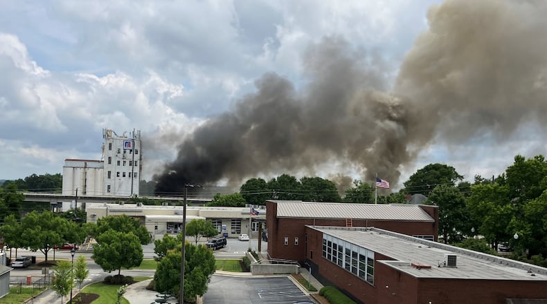 Crews needed a second alarm to extinguish a fire at a former animal feed mill in Chamblee, officials said.